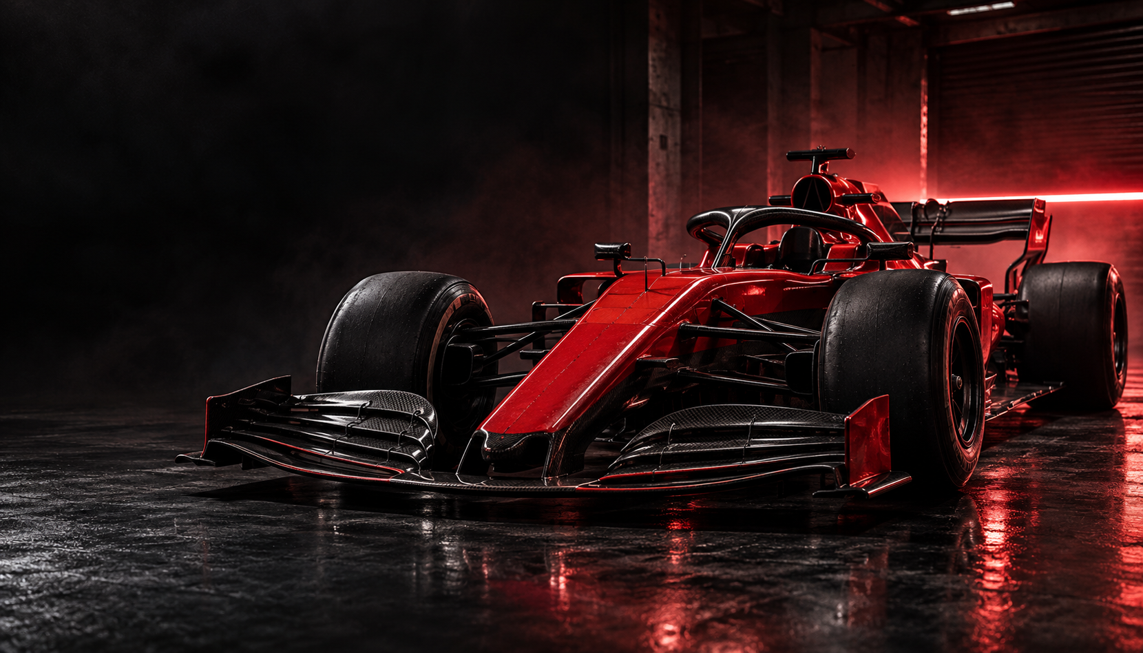 A red Formula racing car illuminated by red lights in a dark garage